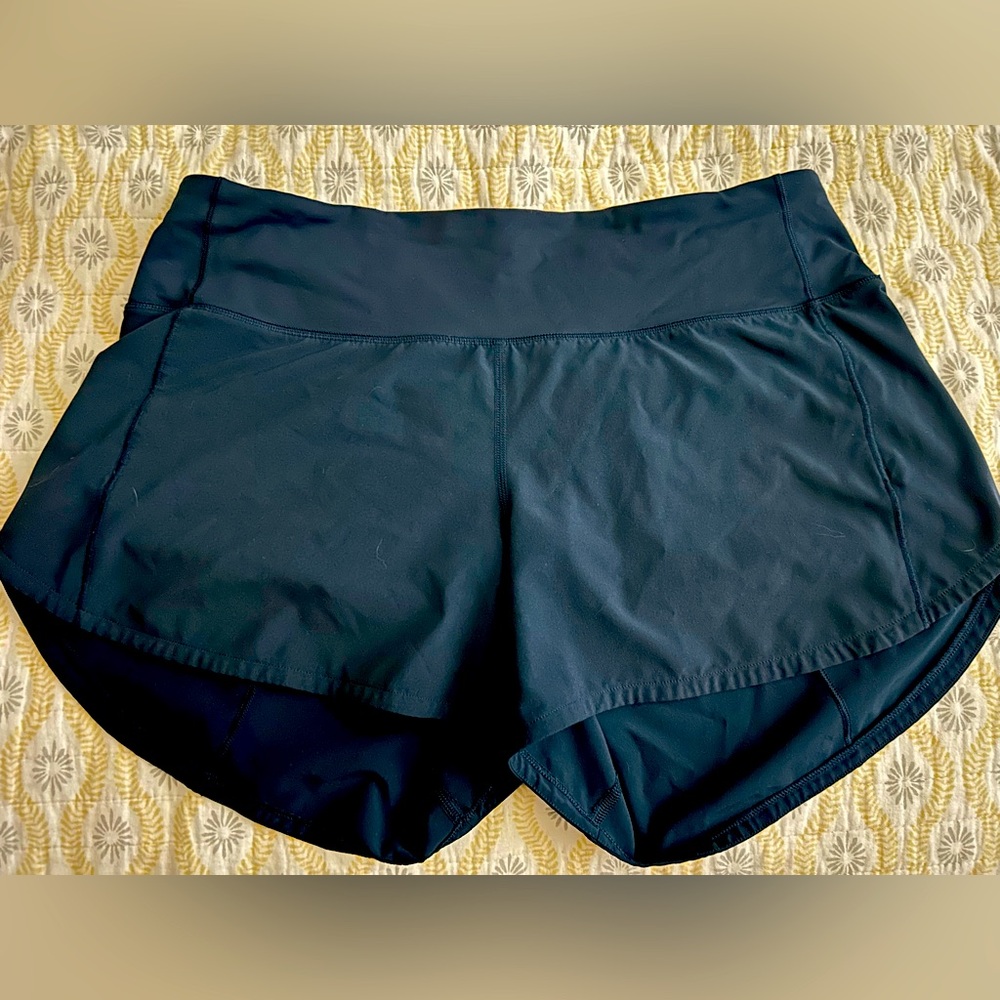 Size 8 Lululemon NAVY speed up shorts size 8. 4” inseam